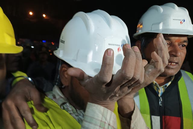 <p>An emotional worker is seen following their rescue from inside the under-construction Silkyara tunnel on the Brahmakal Yamunotri National Highway in Uttarkashi, India</p>