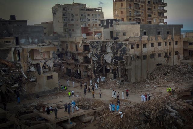 <p>People search for flood victims in Derna, Libya, on 15 September 2023</p>