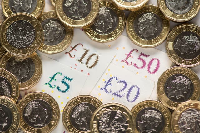 File photo dated 26/01/2018 of UK five pound, ten pound, twenty pound and fifty pound notes with one pound coins. MPs have raised concerns new data powers could allow ministers to snoop on pensioners bank accounts. Picture: PA/ Dominic Lipinski