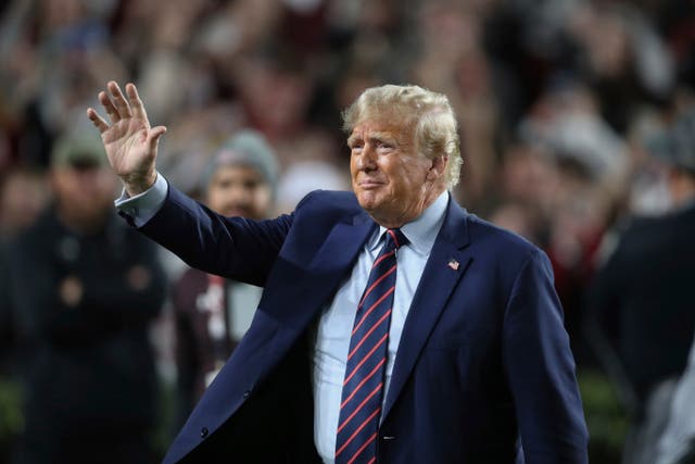 <p>Donald Trump attends a Clemson football game </p>