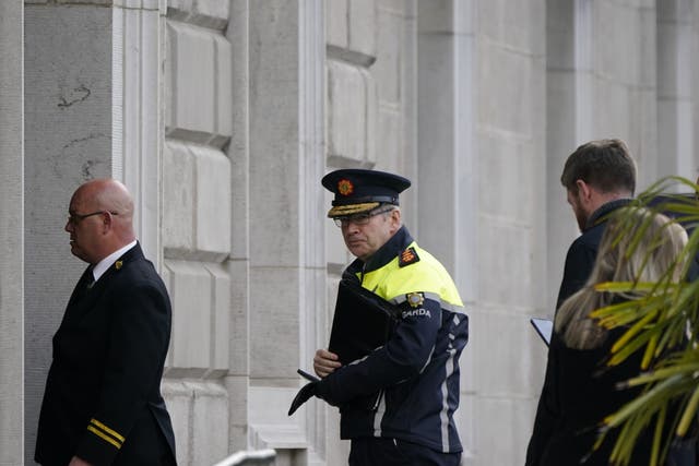 Garda Commissioner Drew Harris (centre) arriving to appear before the justice committee at Leinster House following riots in Dublin (Niall Carson/PA)