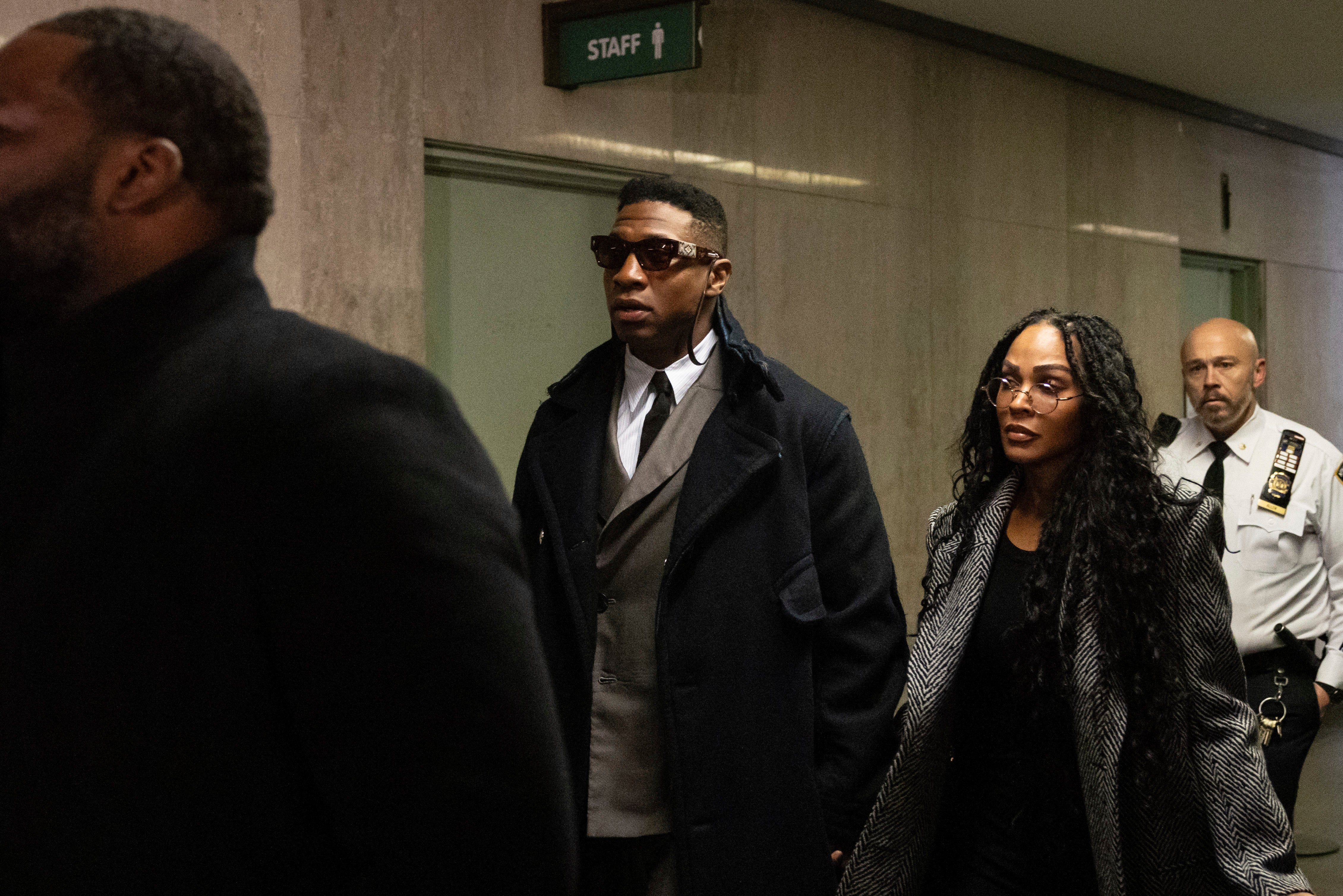 Actors Jonathan Majors, center, and Meagan Good arrive at court for a jury selection on Major's domestic violence case, Wednesday, Nov. 29, 2023, in New York.