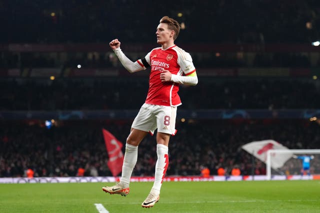 Martin Odegaard celebrates scoring for Arsenal against Lens (John Walton/PA)