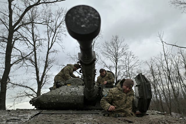 <p>Ukrainian servicemen check their Sweden made CV90 armored infantry combat vehicle on a position pointing in the direction of Bakhmut in the Donetsk </p>