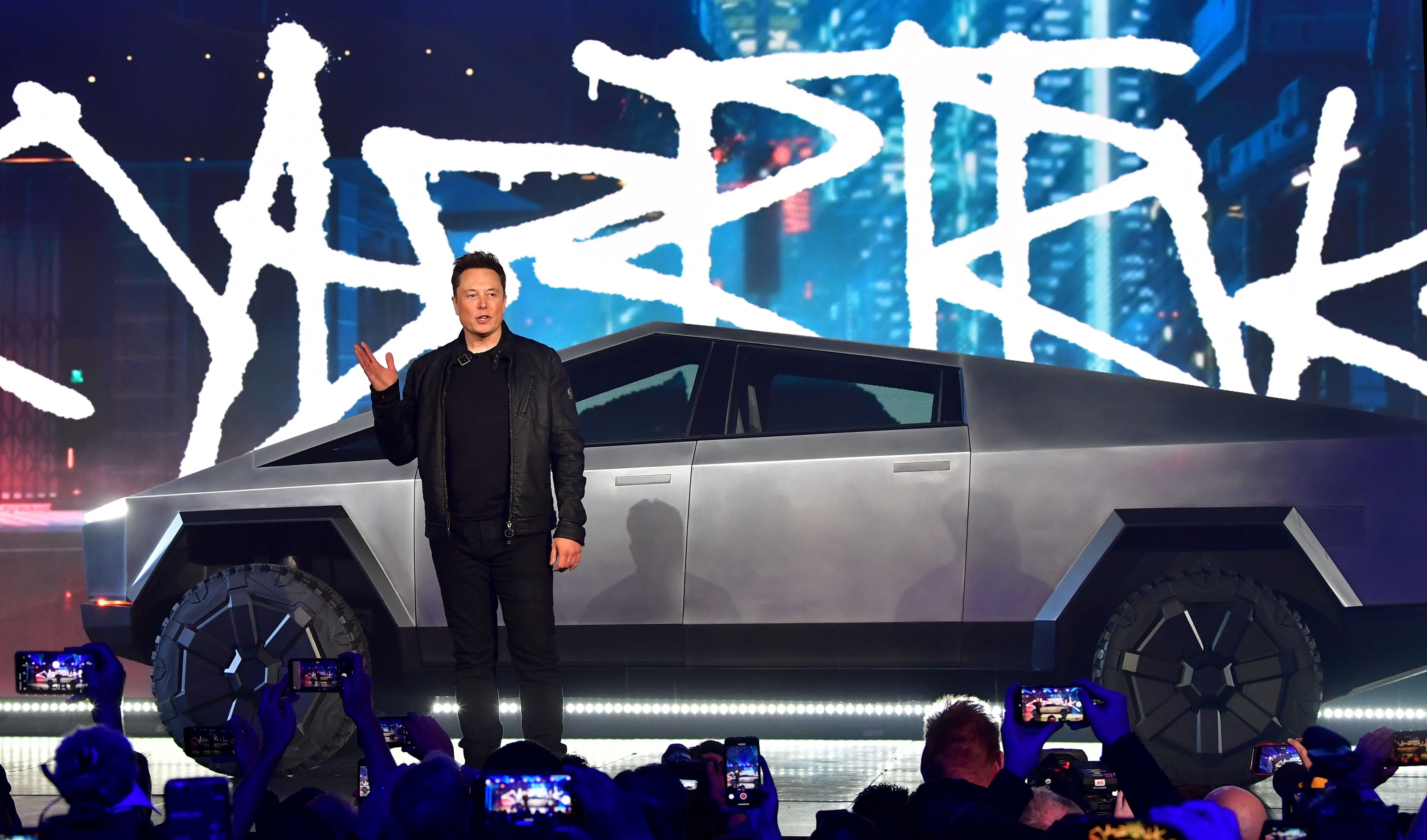 Tesla boss Elon Musk introduces the newly unveiled all-electric battery-powered Tesla Cybertruck at Tesla Design Center in Hawthorne, California on 21 November 2019