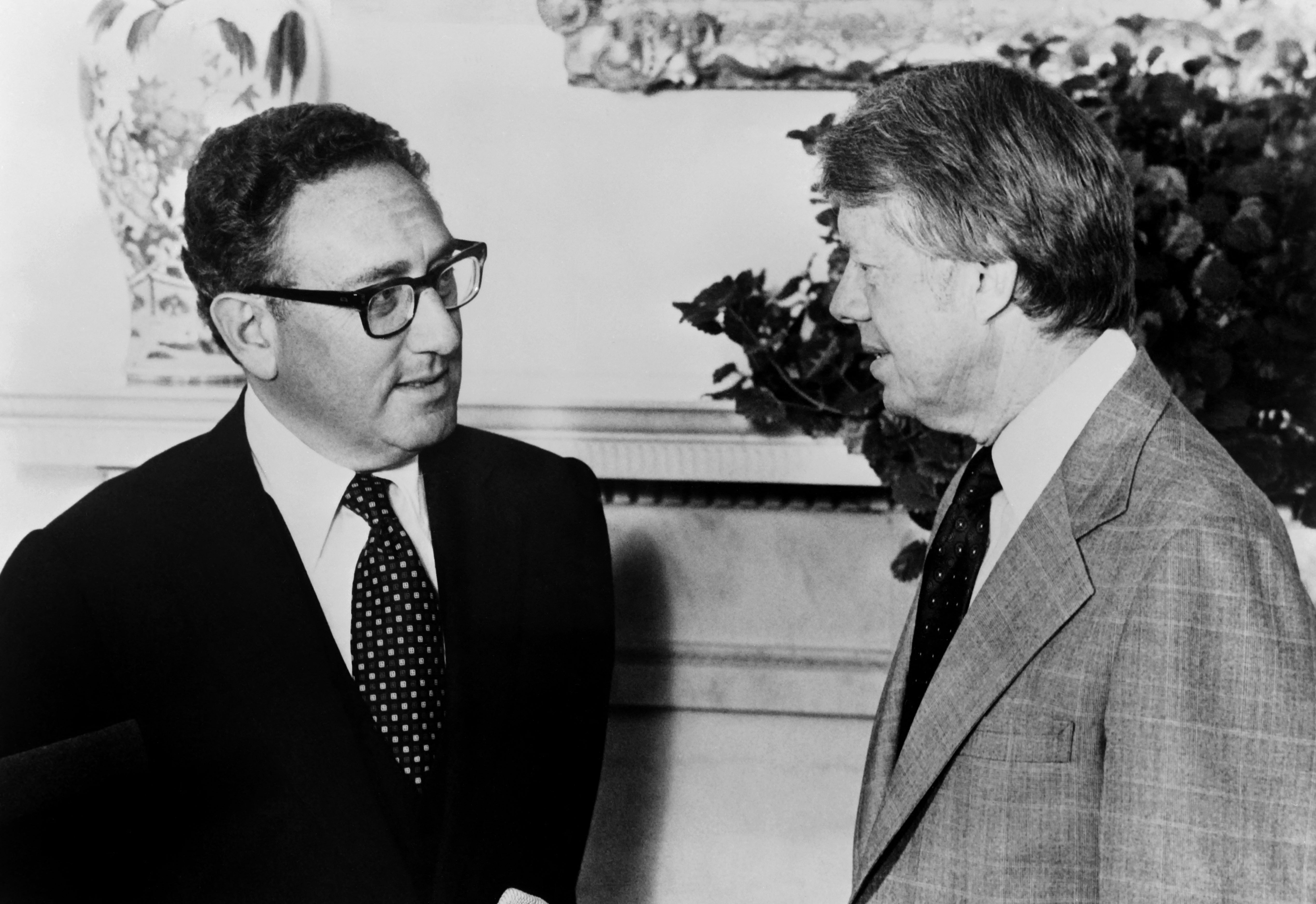 President Jimmy Carter (R) meets former Secretary of State Henry Kissinger to discuss Middle East peace proposals at the White House in Washington on August 15, 1977.