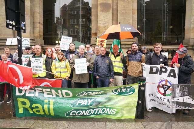 <p>Members of the RMT union have voted overwhelmingly to accept a deal to end their long-running dispute over pay and conditions (Owen Humphreys/PA)</p>