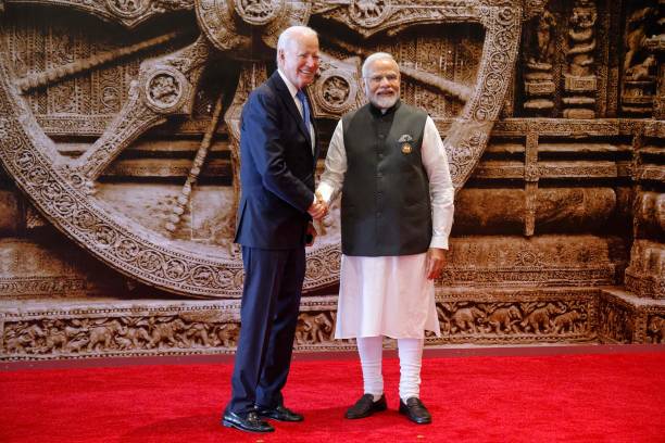 India's PM Modi (right) shakes hand with US President Biden ahead of the G20 Leaders' Summit in New Delhi