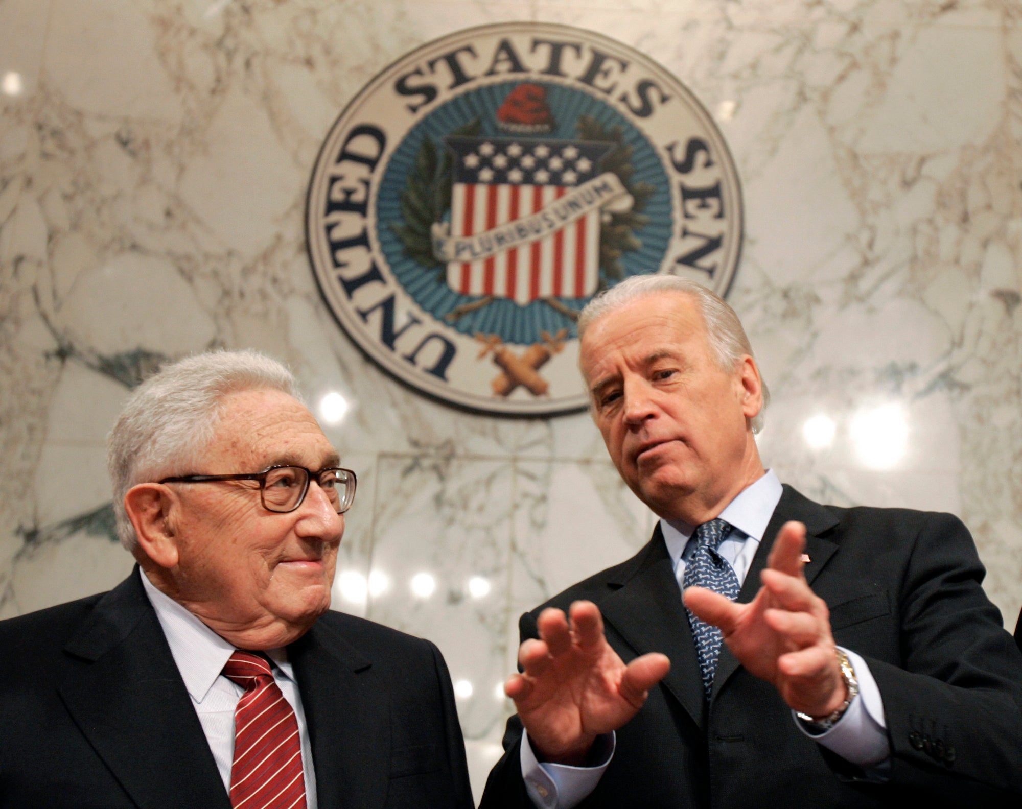 Former Secretary of State Henry Kissinger, left, talks with Senate Foreign Relations Committee Chairman Sen. Joseph Biden, D-Del., on Capitol Hill in Washington, Jan. 31, 2007, prior to Kissinger testifying before the committee about Iraq.