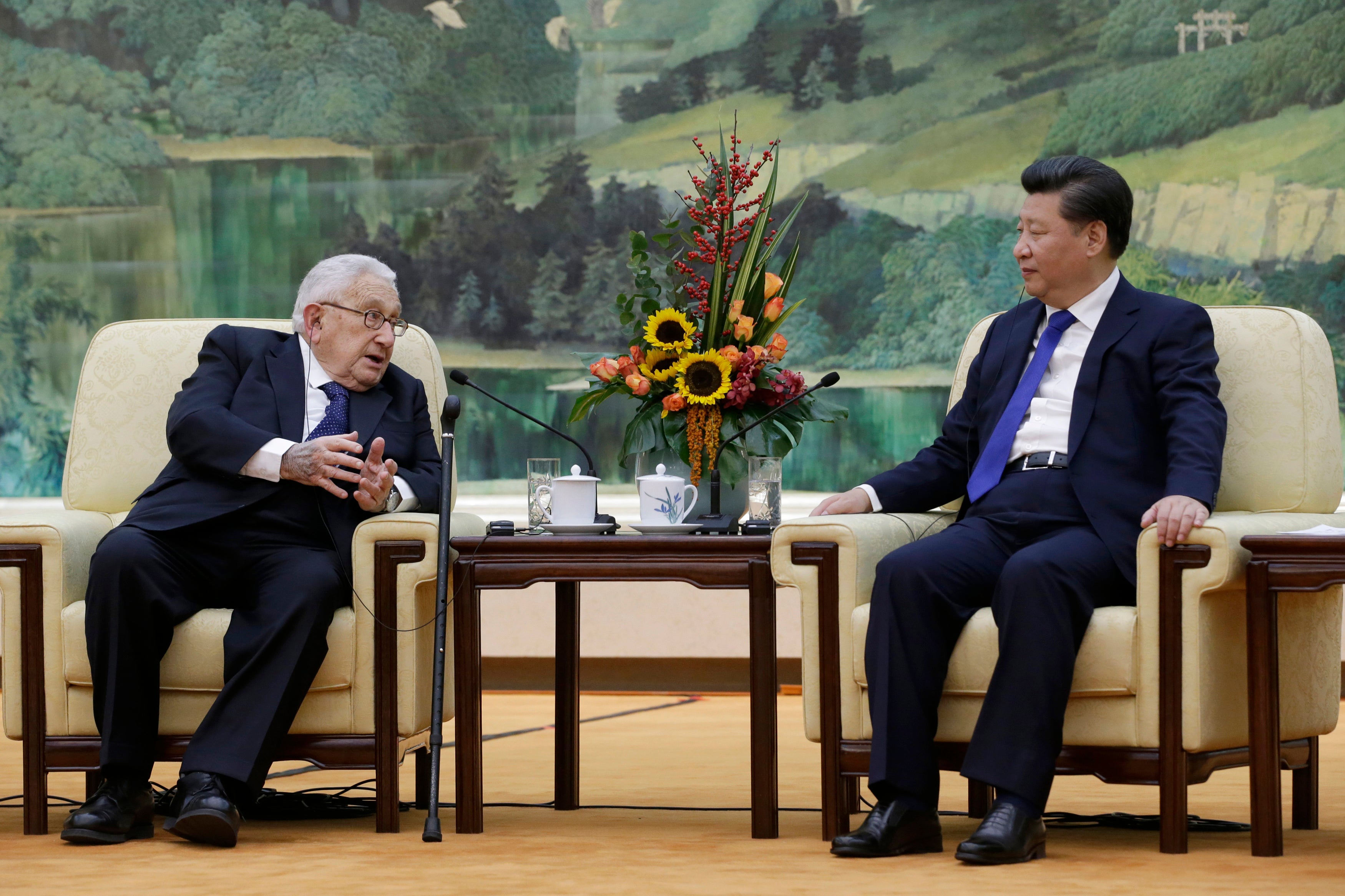 China’s President Xi Jinping (R) speaks with former US secretary of state Henry Kissinger during a meeting in Beijing on July 20, 2023