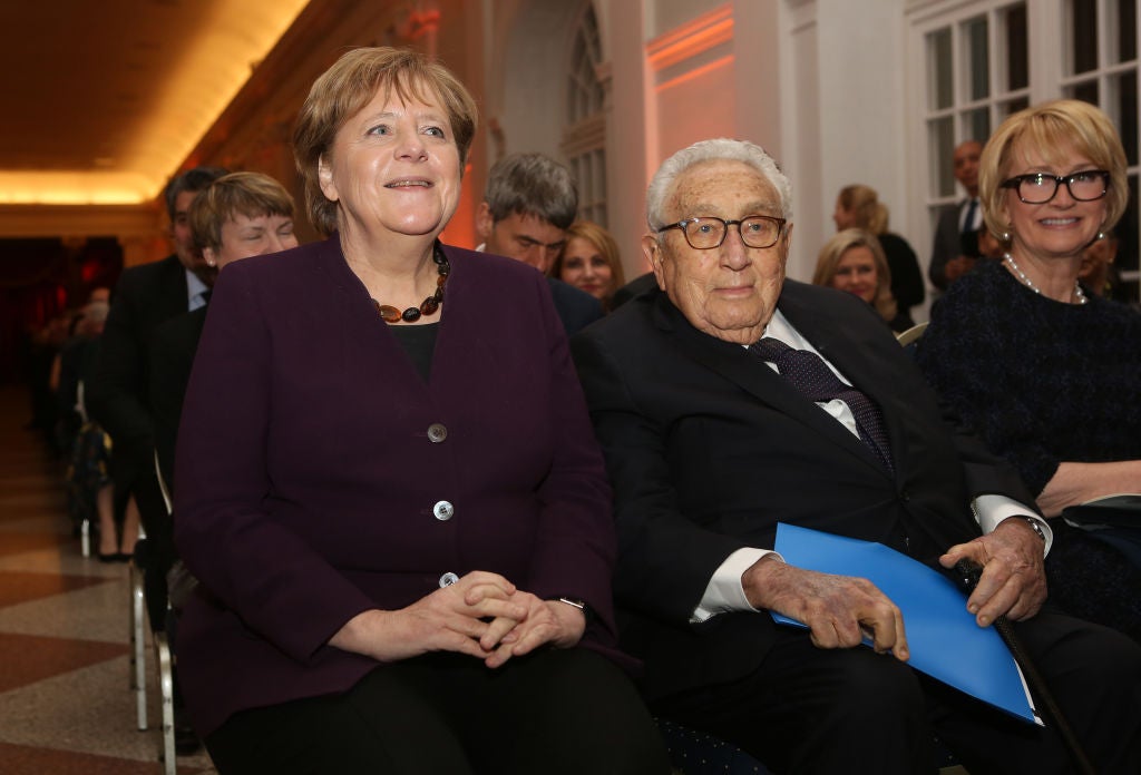 German Chancellor Angela Merkel, left, and Henry A. Kissinger, right, former US Sectretary of State, arrive for the award ceremony for the Henry A. Kissinger Prize 2020 at the Charlottenburg palace in Berlin, Germany, 21 January 2020