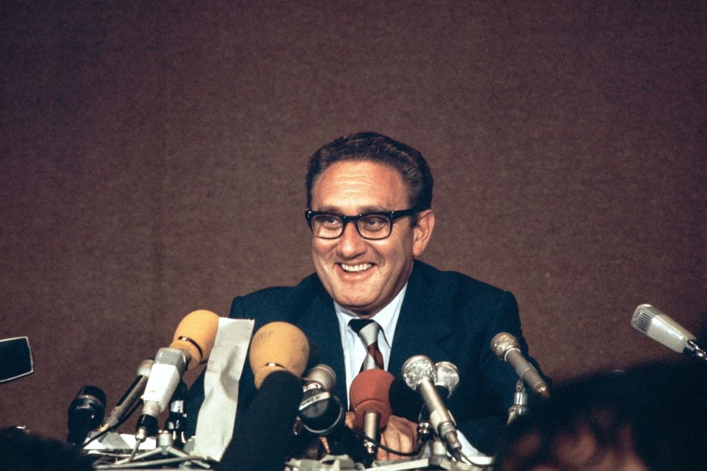 <p>Henry Kissinger laughs during a press conference, after the final communique on the implementation of the Vietnam Peace Accords, signed by Kissinger and the North Vietnamese delegation leader, Le Duc Tho, on 13 June 1973 in Paris</p>