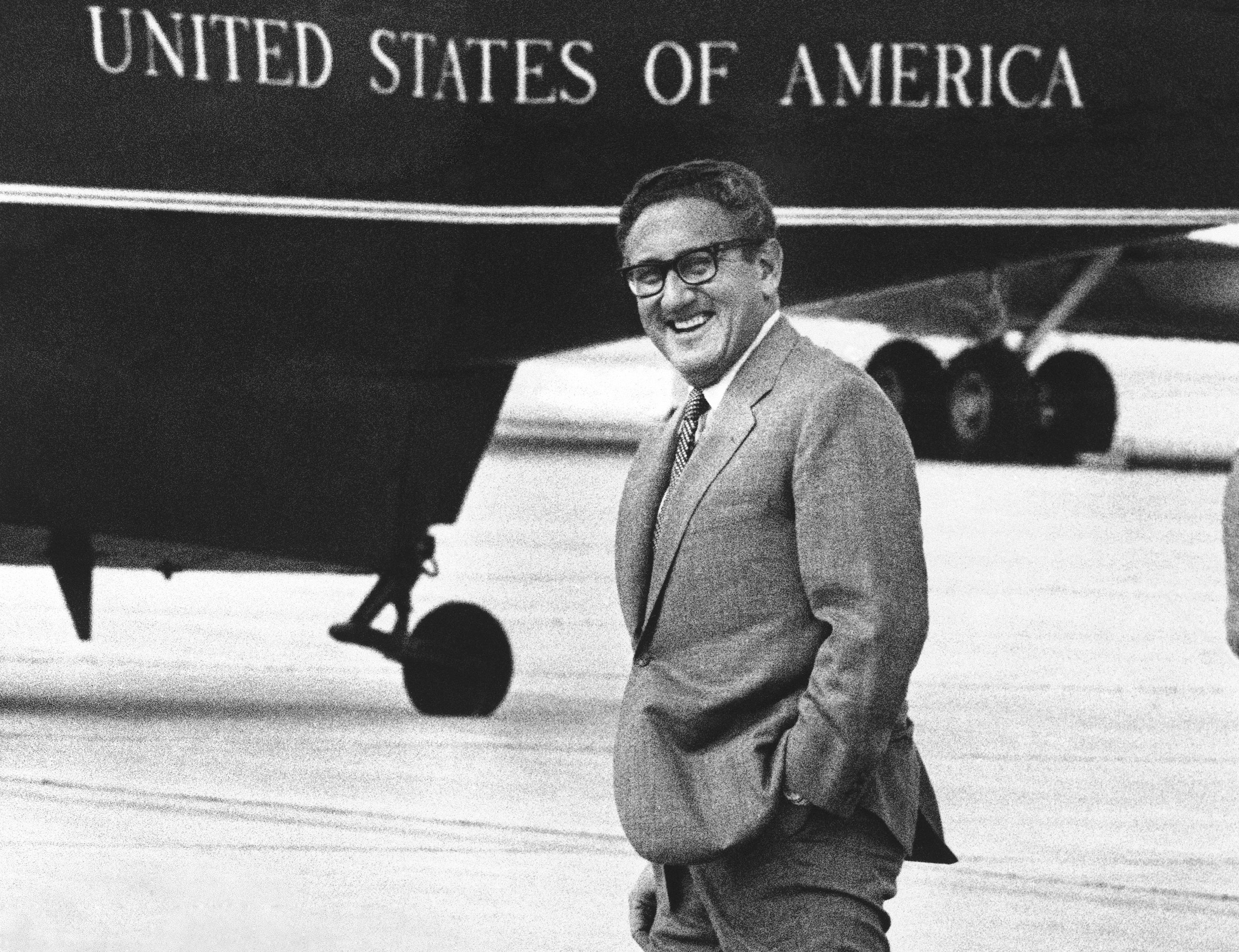Henry Kissinger smiles as he walks to a helicopter at Andrews Air Force Base near Washington, Saturday, Aug. 19, 1972