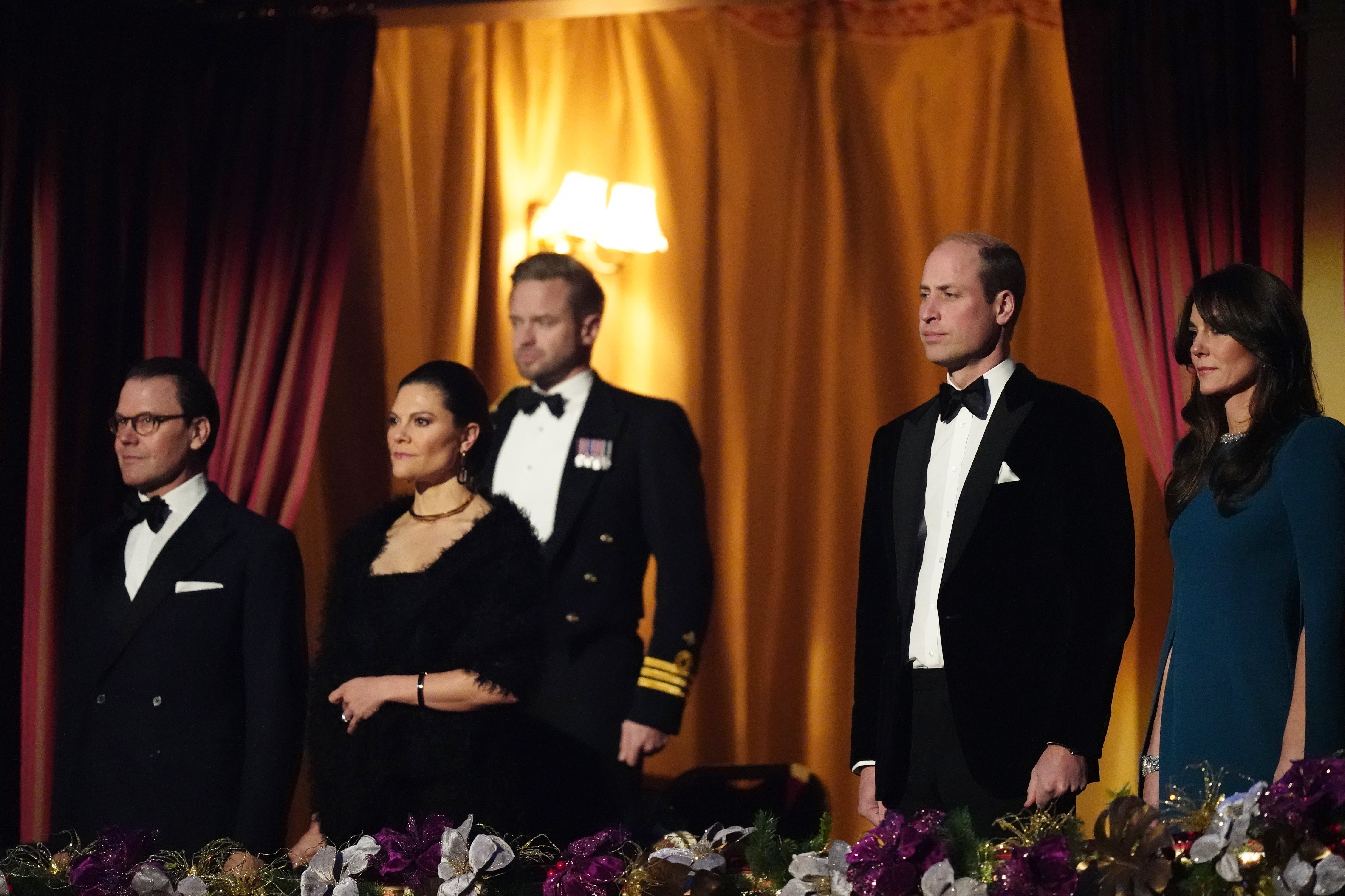 The couple stood for the National Anthem alongside Crown Princess Victoria and Prince Daniel of Sweden