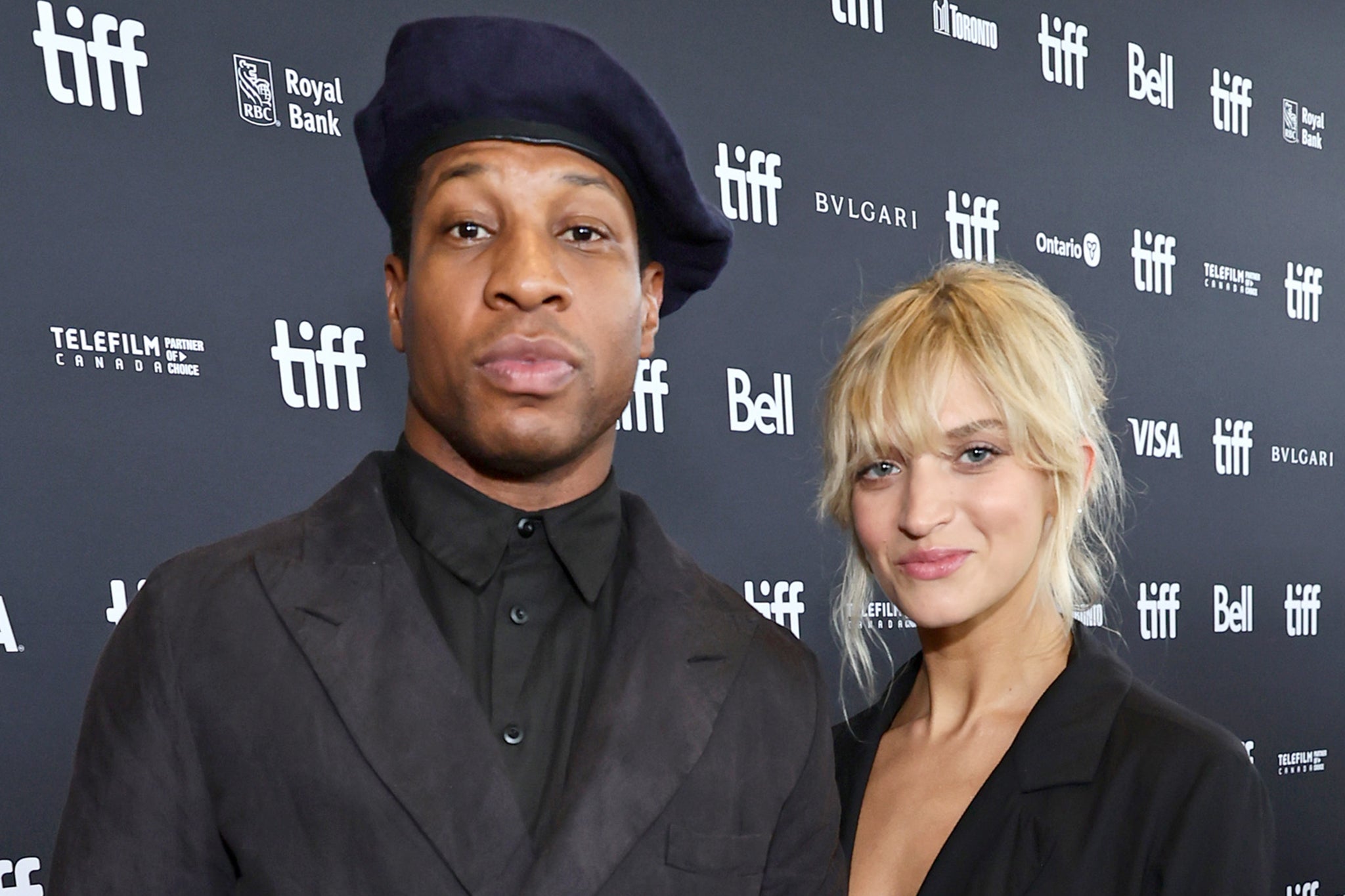 Jonathan Majors and guest Grace Jabbari attend the “Devotion” Premiere at Cinesphere in September 2022 in Toronto