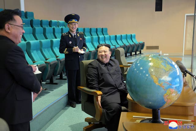<p>North Korea’s leader Kim Jong Un (R) preparing for the operation of the reconnaissance satellite during a visit to the Pyongyang General Control Center at the State Directorate of Aerospace </p>