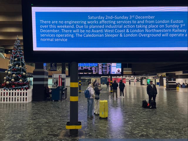 <p>Dismal December: Passengers at London Euston station on the first day of the latest round of industrial action</p>
