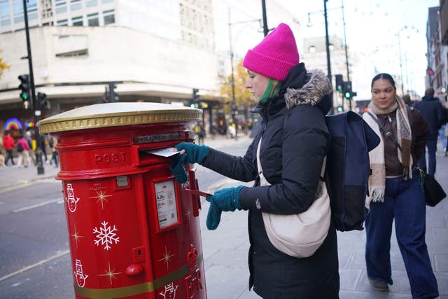 A Royal Mail Christmas postbox on Oxford Street (Yui Mok/PA)