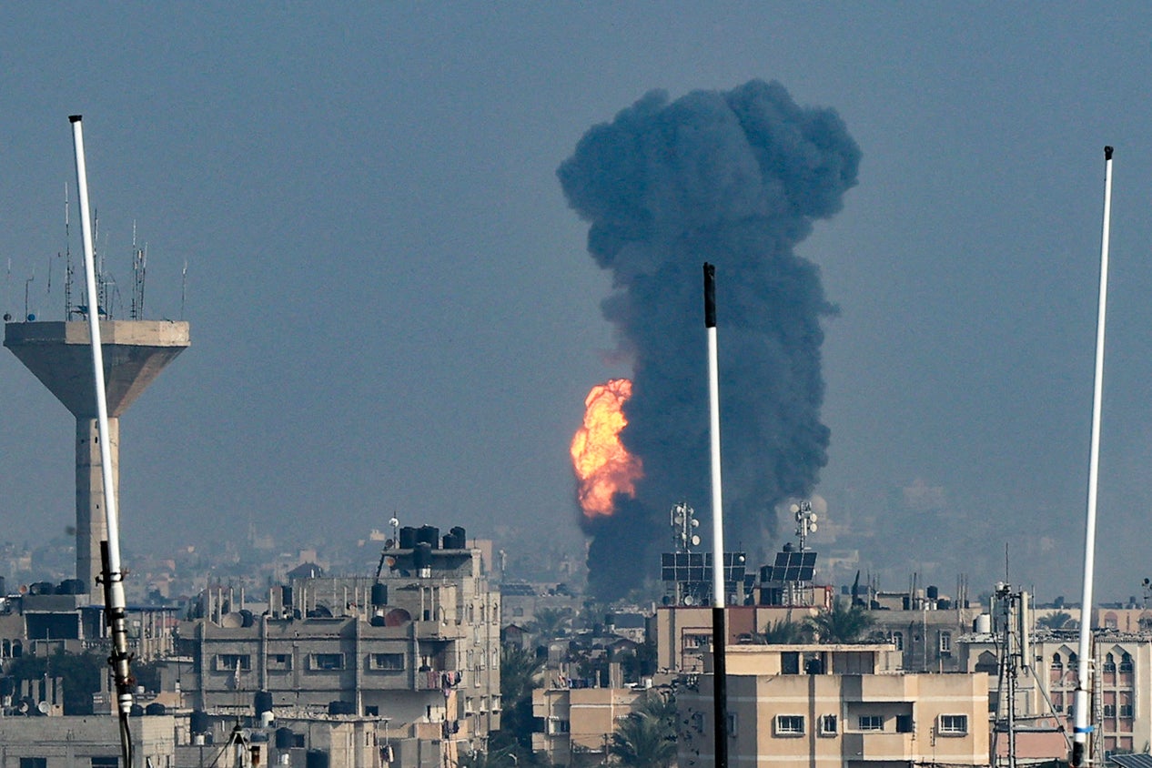 <p>Smoke rises above buildings during an Israeli strike on Rafah in the southern Gaza Strip on Friday </p>