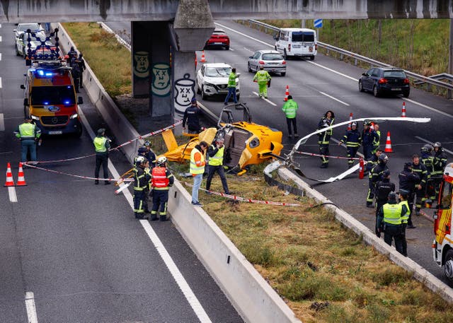 <p>The helicopter crashed into the busy motorway in front of drivers  </p>