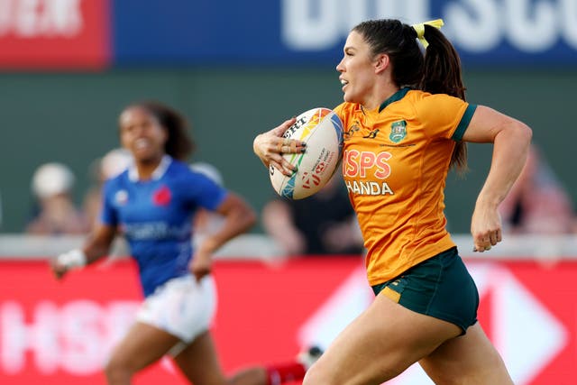 <p>Charlotte Caslick of Australia runs the ball for a try during the Women's Cup Semifinal match</p>