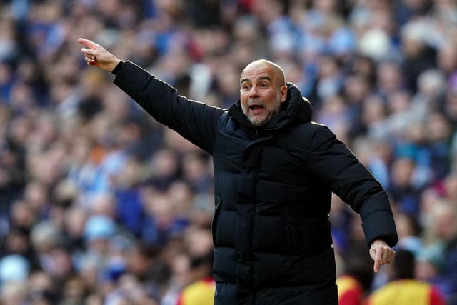Pep Guardiola will face Ange Postecoglu for the first time in a competitive fixture this weekend (Martin Rickett/PA)