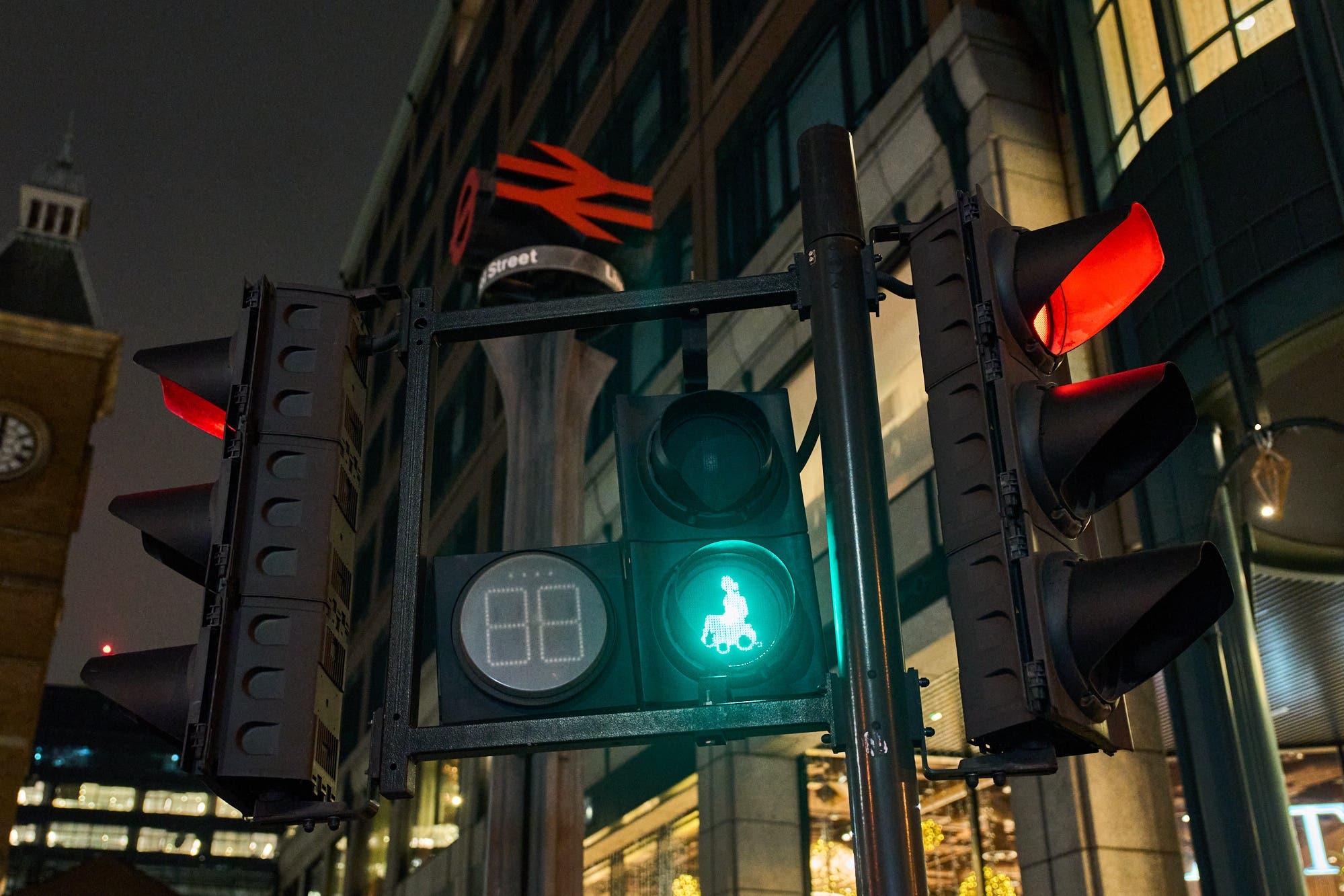 New green wheelchair user traffic light signals have been installed at road crossings in London to raise awareness of the capital’s disabled population (TfL/PA)