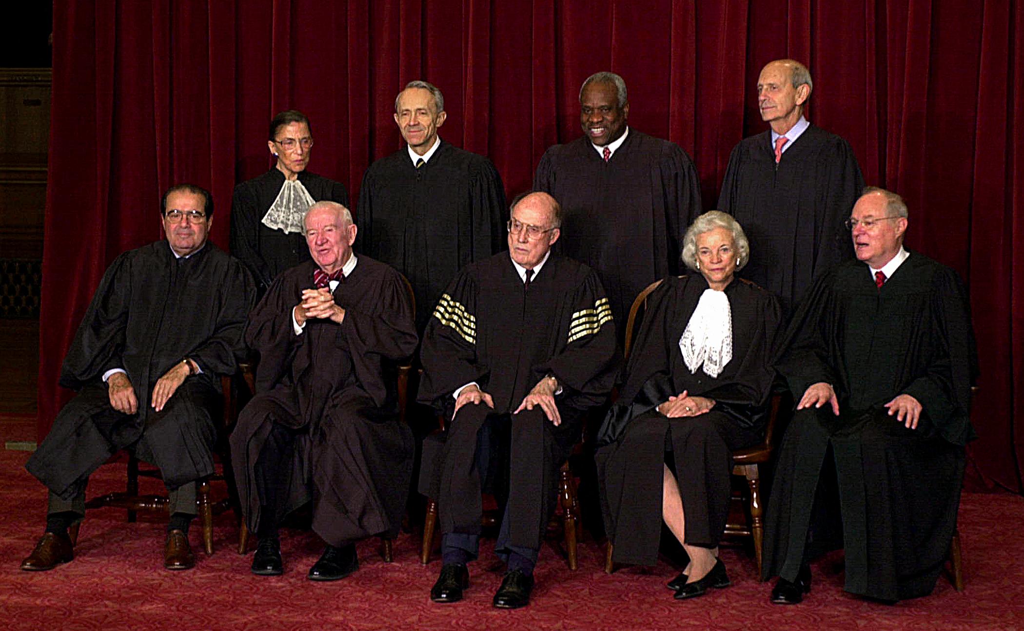 Justices of the Supreme Court of the United States pose for an official photo in December 2003