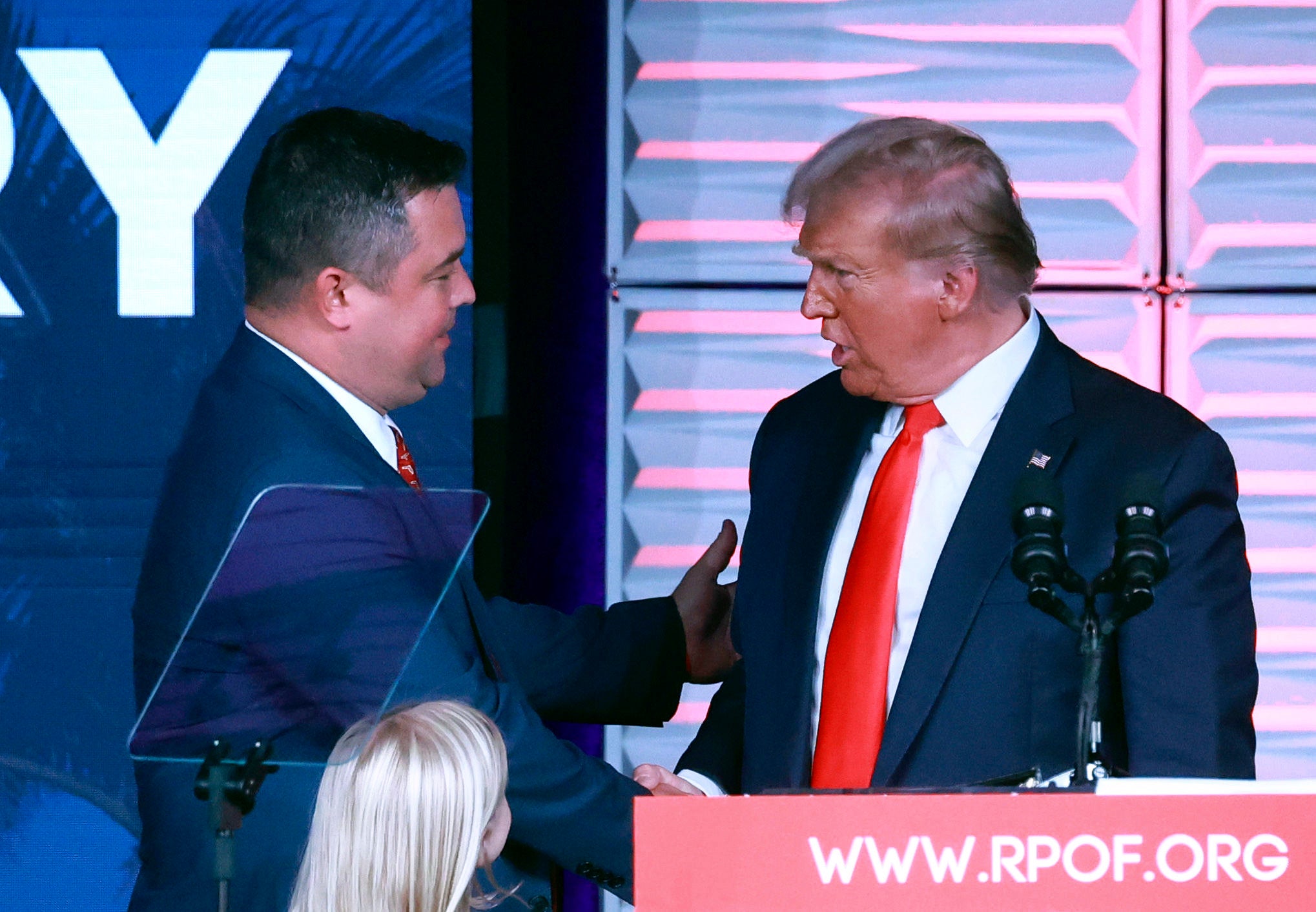 Republican Party of Florida chairman Christian Ziegler, left, greets former president Donald Trump at the RPOF Freedom Summit in November