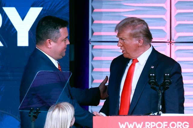<p>Republican Party of Florida chairman Christian Ziegler, left, greets former president Donald Trump at the RPOF Freedom Summit in November </p>