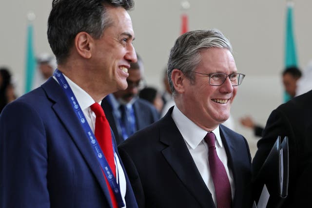 <p>Labour Party leader Sir Keir Starmer walks with shadow secretary of state for energy security and net zero Ed Miliband at Cop28 (Chris Jackson/PA)</p>
