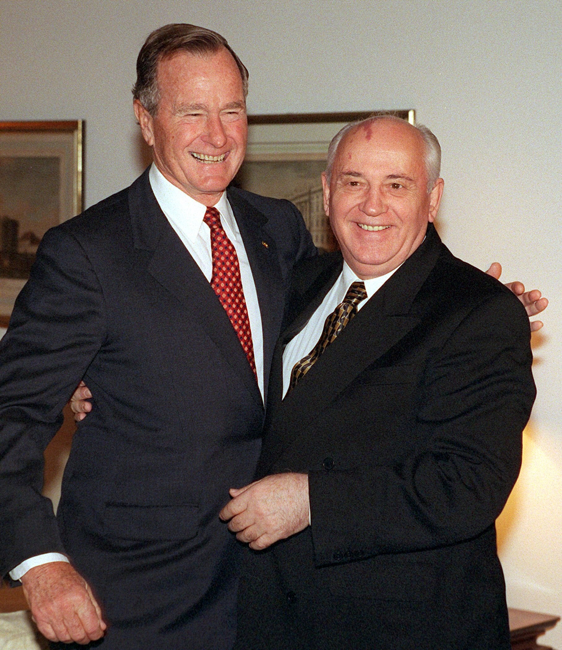 Picture taken on September 9, 1999 shows former US President George Bush (L) and former Soviet leader Mikhail Gorbachev at the German presidential Bellevue Palace in Berlin
