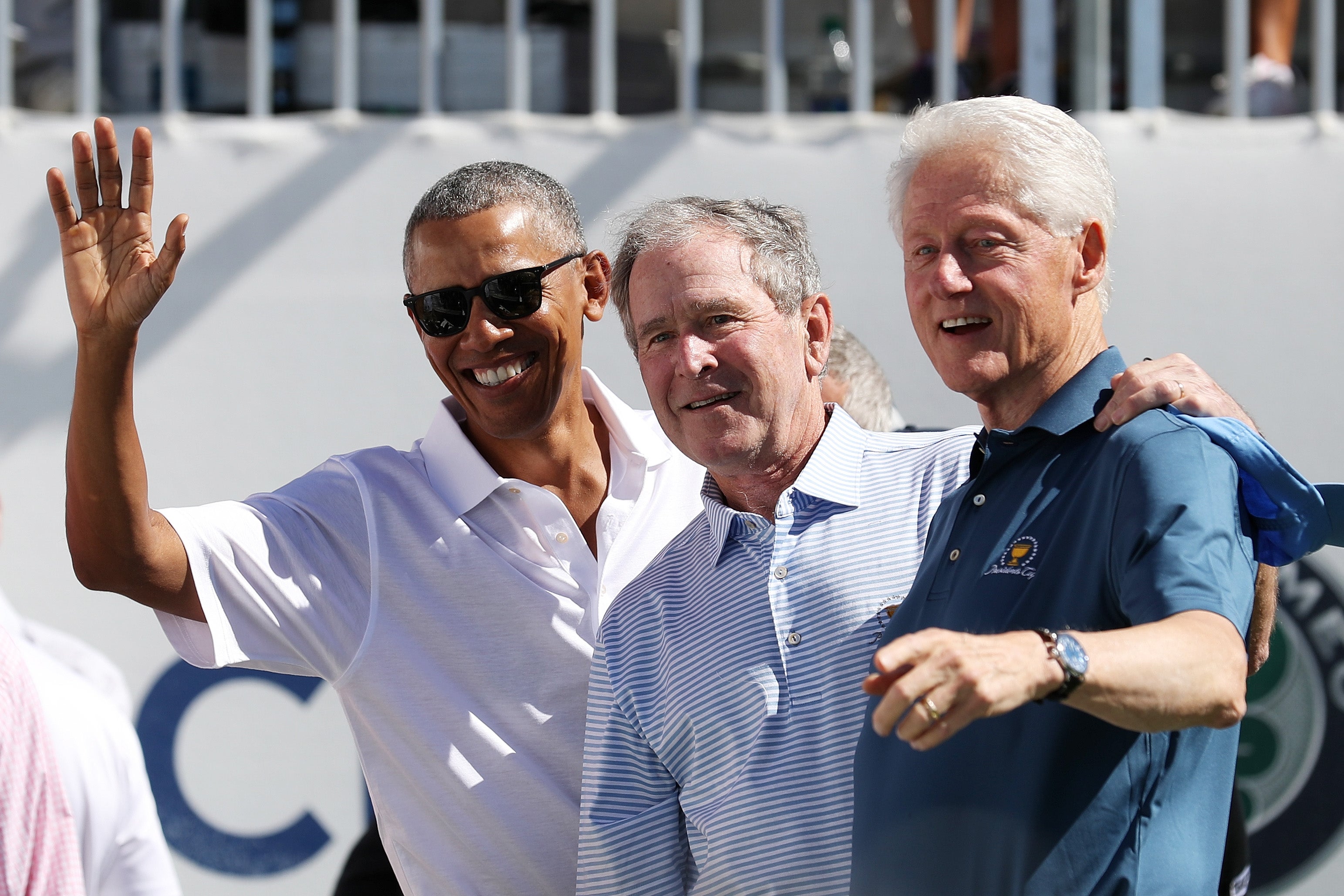 Former U.S. Presidents Barack Obama, George W. Bush and Bill Clinton attend the trophy presentation prior to Thursday foursome matches of the Presidents Cup at Liberty National Golf Club on September 28, 2017 in Jersey City, New Jersey