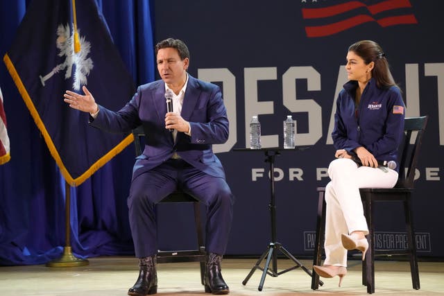 <p>Florida Gov. Ron DeSantis, left, speaks during an event for his GOP presidential campaign as his wife Casey DeSantis looks on, on Friday, Dec. 1, 2023, in Prosperity, S.C.</p>