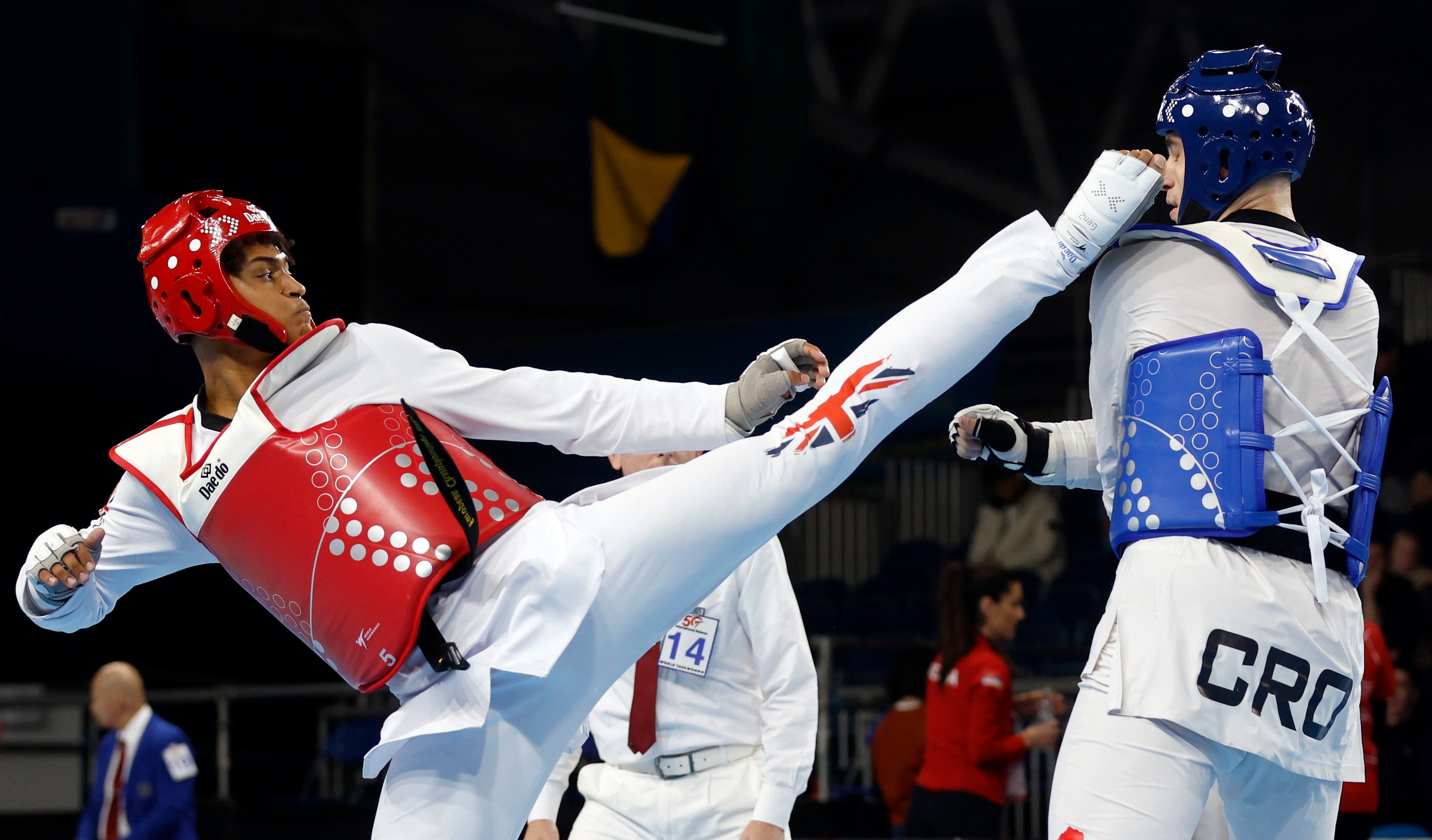 Cunningham, left, in action at the 2023 World Taekwondo Grand Prix final in Manchester