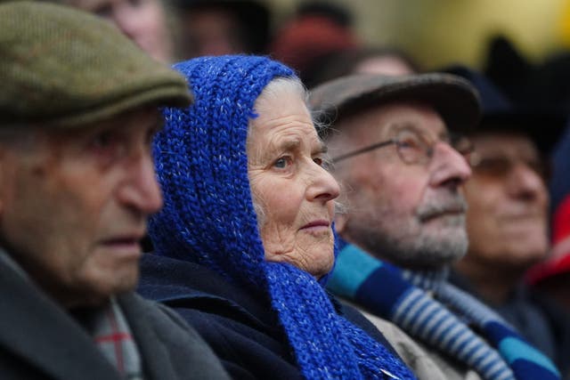 People watch a ceremony at Liverpool Street Station to mark the 85th anniversary of the Kindertransport (Victoria Jones/PA)