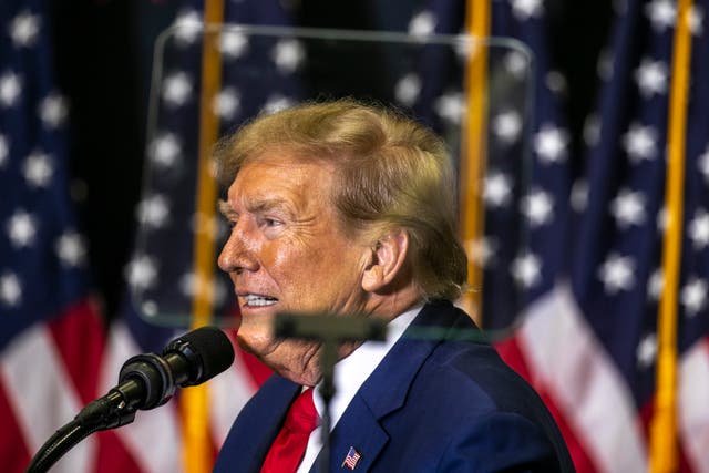 <p>Republican presidential candidate and former President Donald Trump speaks to the crowd during a caucus event in Iowa</p>