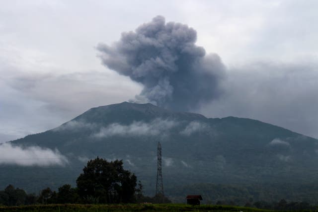 <p>Volcanic ash spews from Mount Marapi during an eruption as seen from Batu Palano village in Agam</p>
