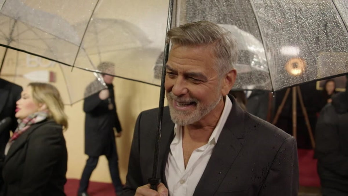 George Clooney jokes about his age as he braves rain for The Boys in the Boat London premiere