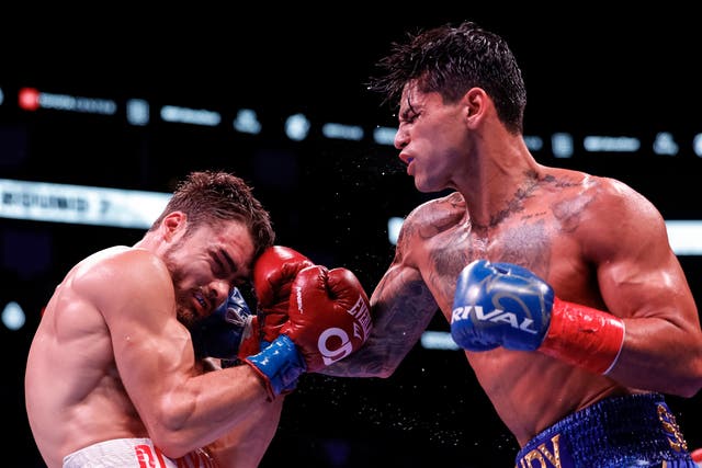 <p>Ryan Garcia, right, secured an eighth-round TKO against Oscar Duarte</p>