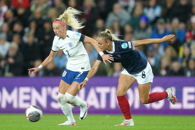 England’s Chloe Kelly, left, and Scotland’s Samantha Kerr battle for the ball in September’s meeting (Owen Humphreys/PA)