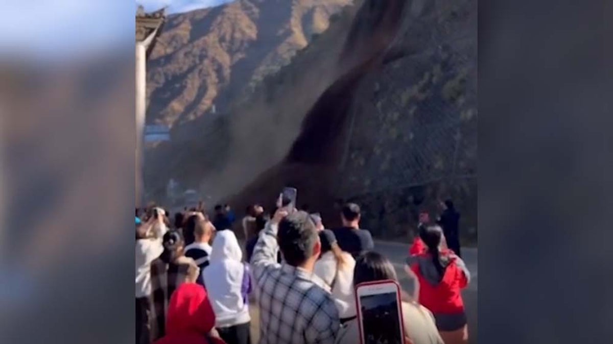 Tourists flee for lives as landslide crashes metres away in China