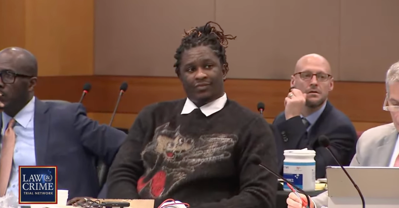 Young Thug in court on Monday, 4 December, wearing a sweater with a wolf design.
