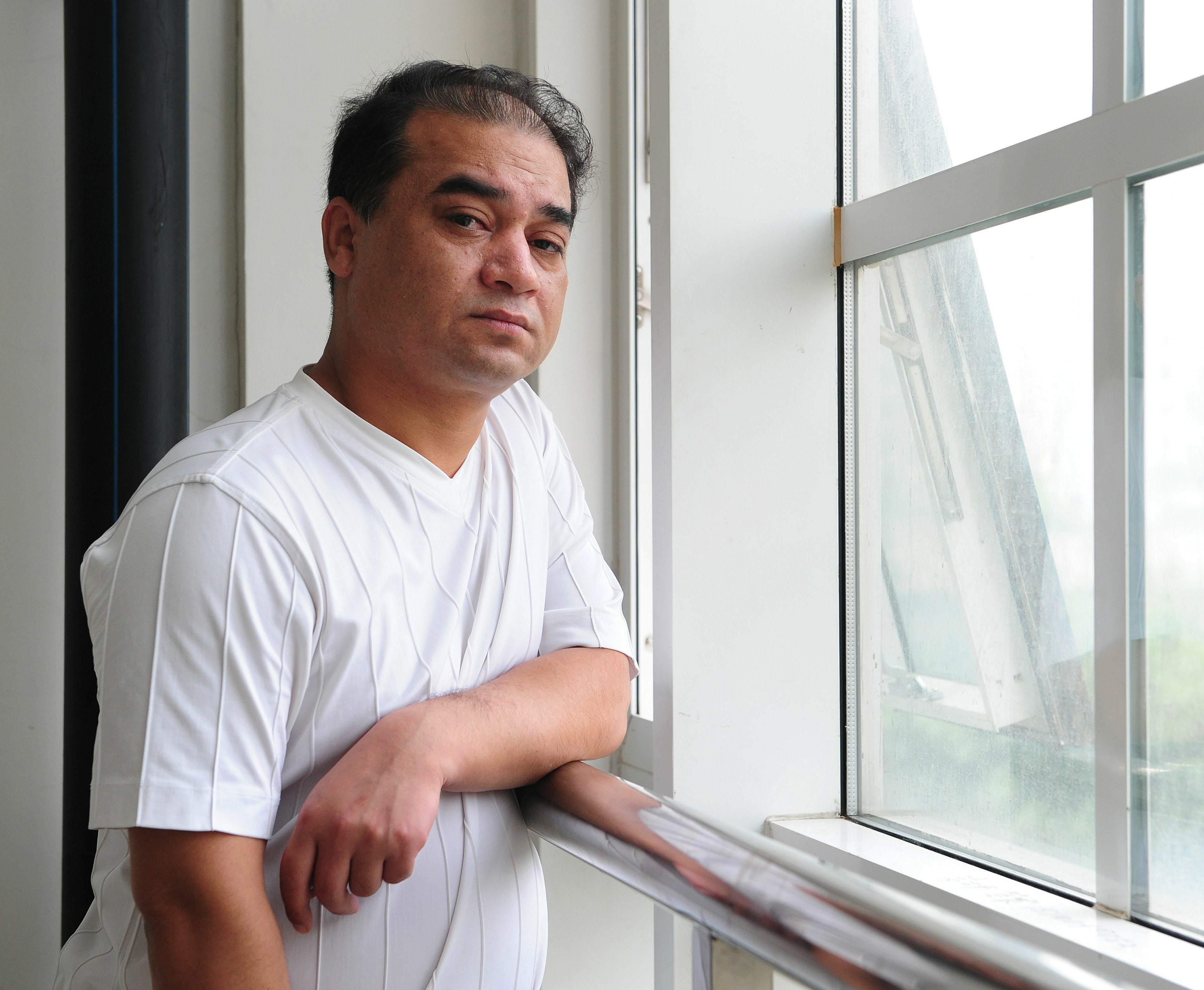 File: University professor, blogger, and member of the Muslim Uighur minority, Ilham Tohti pauses before a classroom lecture in Beijing on 12 June 2010