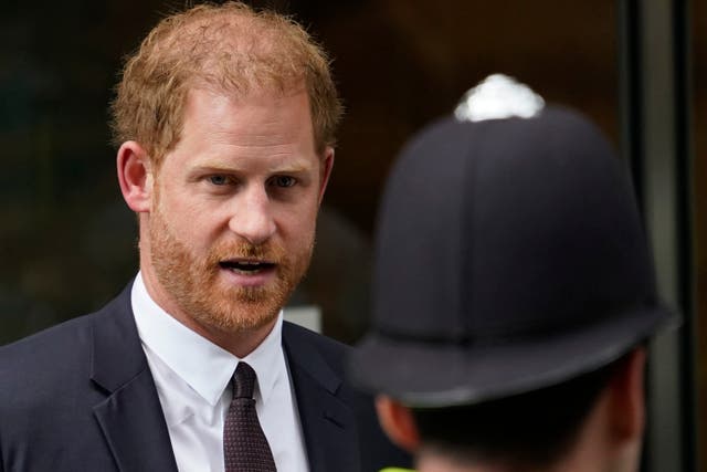 <p>Prince Harry leaves the High Court in June</p>