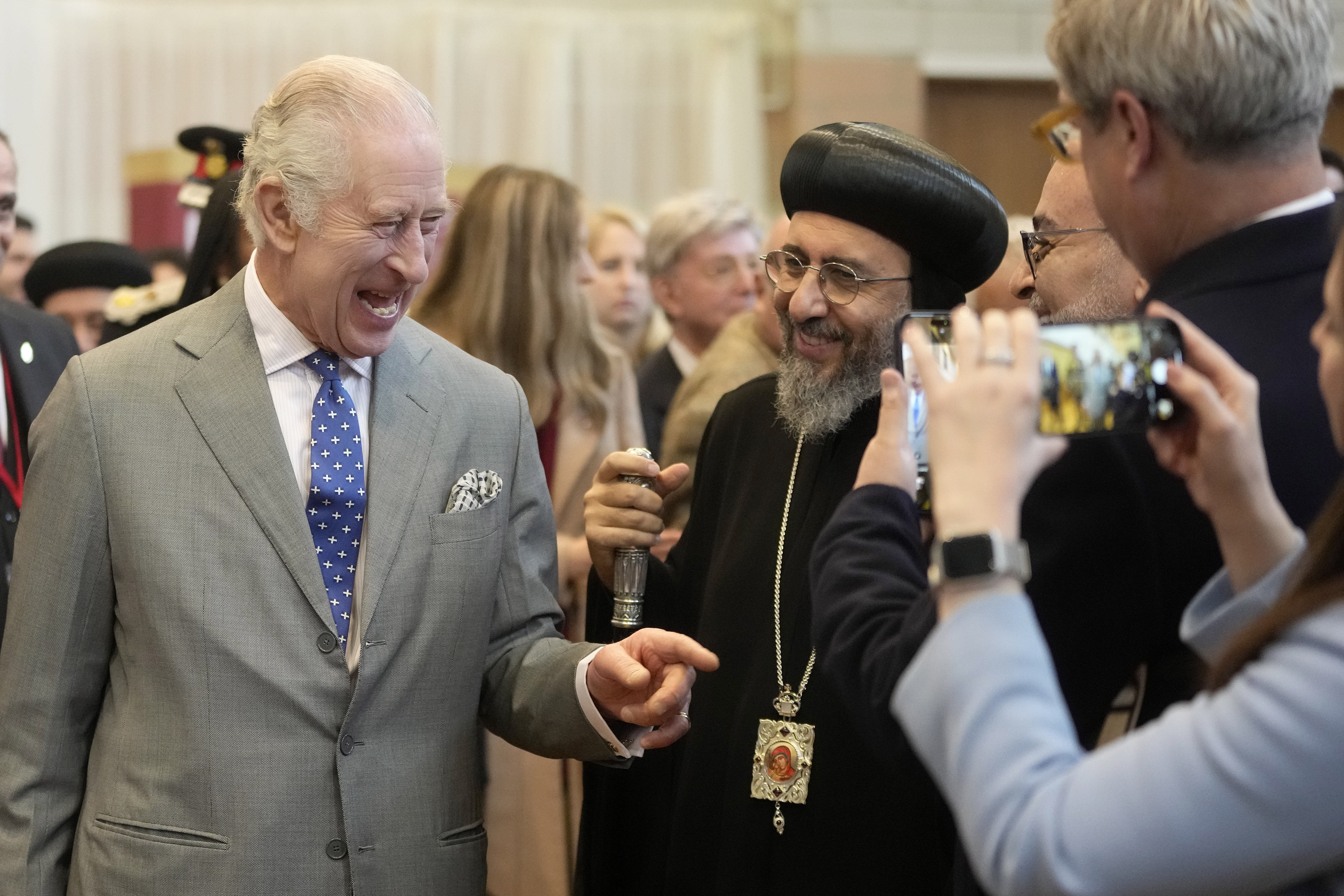 The King was given a handwritten Christmas letter by a young girl during a visit to the Coptic Orthodox Church Centre UK in Hertfordshire (Kin Cheung/PA)