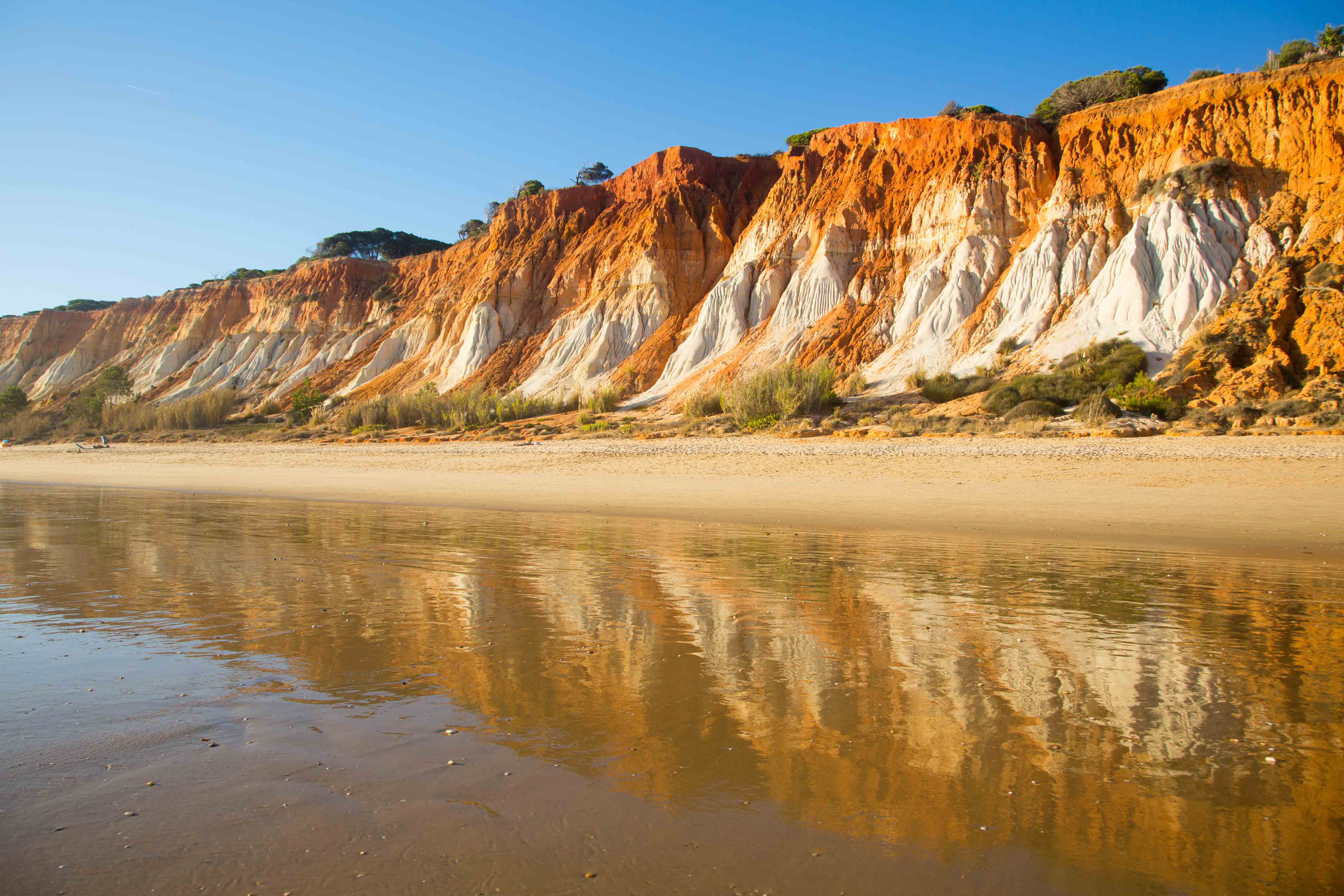 Gorgeous beaches abound in the Algarve – such as the dramatic golden cliffs of Praia da Falésia