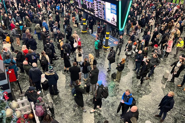 <p>Passengers battle delays at Euston earlier this month </p>