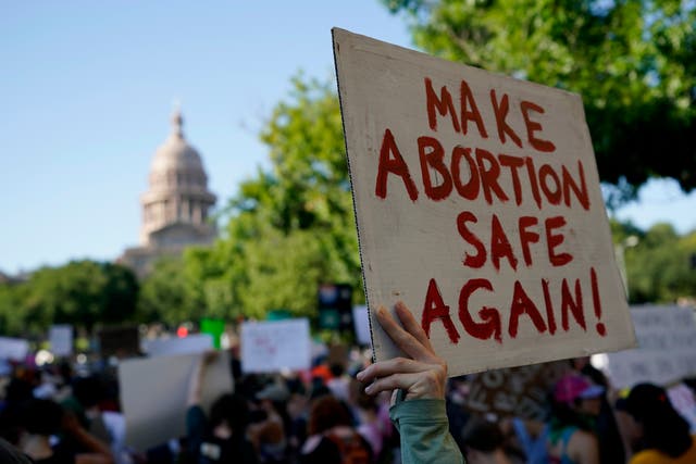 <p>Demonstrators march and gather near the state capitol following the Supreme Court's decision to overturn <em>Roe v Wade</em>, 24 June 2022, in Austin, Texas</p>