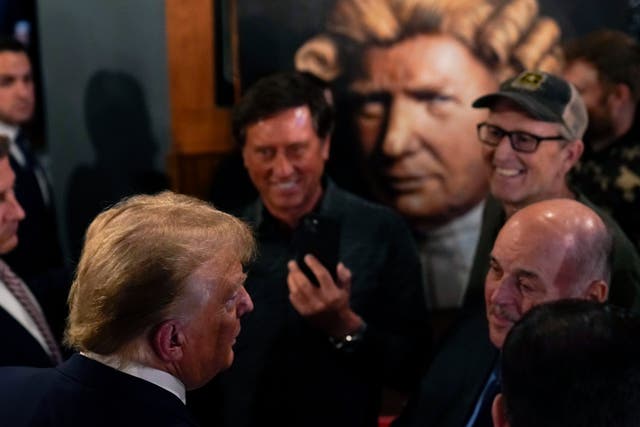 <p>Former President Donald Trump greets supporters during a stop at the Front Street Pub & Eatery</p>